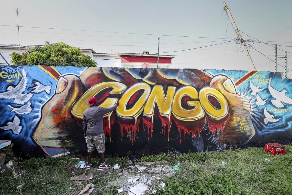 A graffiti artist spray-paints a mural depicting the ‘Congo’ letters bleeding as tribute to the victims of the conflict in the eastern Democratic Republic of Congo, at the Tipo Studio, in Nairobi, Kenya, on Friday. Photo: EPA-EFE