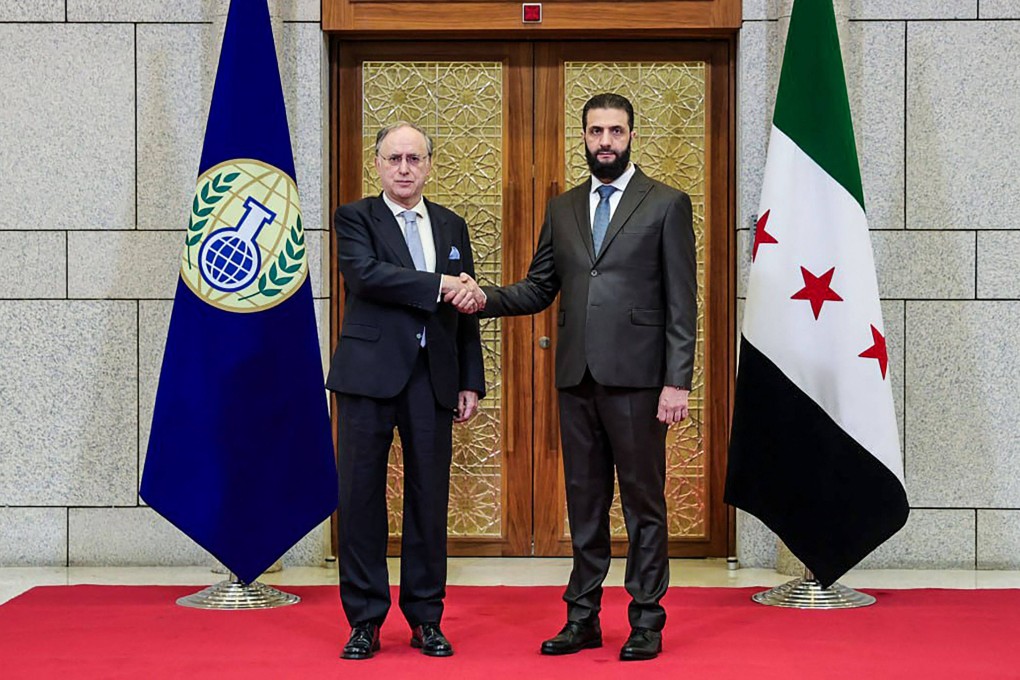 Syria’s President Ahmed al-Sharaa greets the UN chemical weapons watchdog chief, Fernando Arias, before a meeting in Damascus on Saturday. Photo: AFP