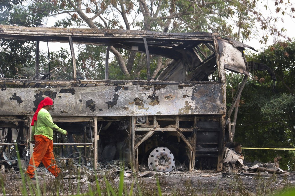A damaged bus that was travelling from Cancun to Tabasco, Mexico, is seen after a fatal crash on Saturday. Photo: Reuters