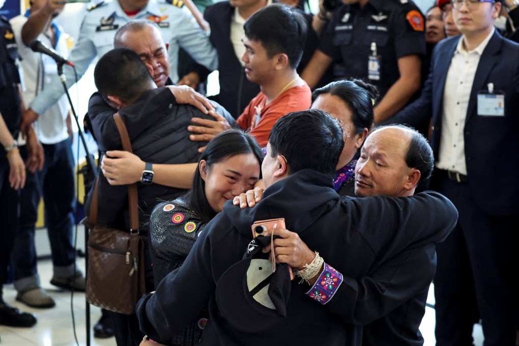 Released Thai hostages embrace their loved ones at Bangkok airport on Sunday. Photo: Reuters