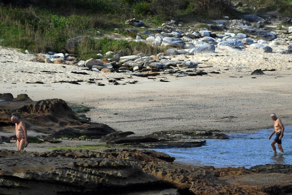 Elderly men walk along a beach in Sydney. In Sydney, only 4 per cent of single retirees relying on income support can afford to rent a one-bedroom home, according to a new report. Photo: AFP