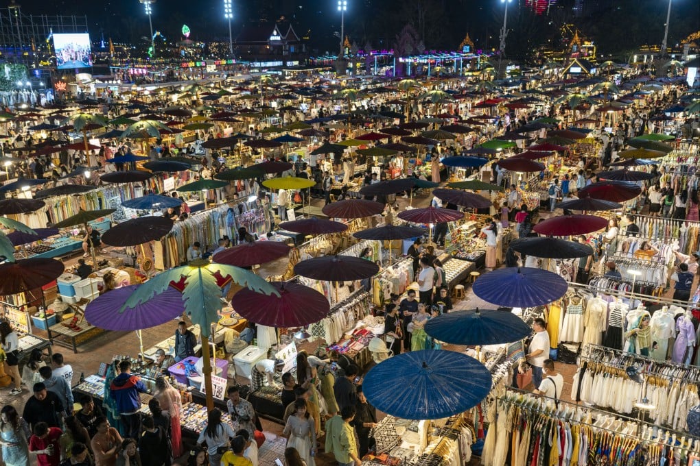Tourists visit a night fair in the southwestern Chinese city of Jinghong in Xishuangbanna Dai autonomous prefecture in February 2023. Photo: Xinhua