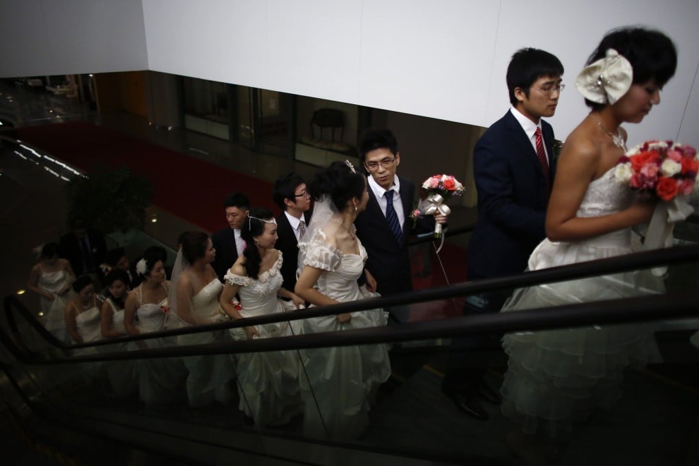 Couples arrive at a staged mass wedding in Shanghai. China’s marriage registrations have plummeted in recent years, exacerbating the country’s demographic crisis. Photo: Reuters