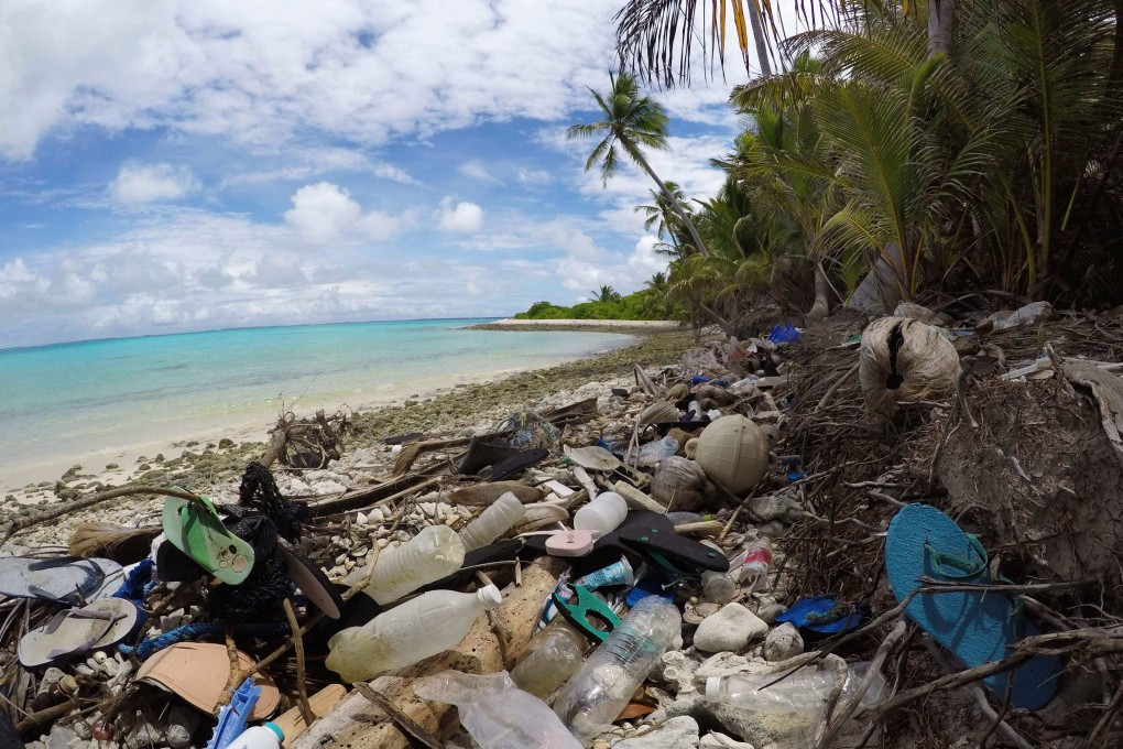 A beach on Cocos Islands is seen strewn with flotsam, jetsam and plastic debris. Photo: University of Tasmania/AFP