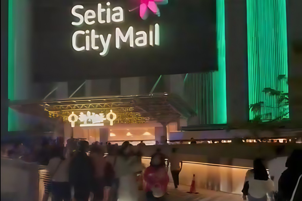 Shoppers are seen gathered outside Setia City Mall in Malaysia on Saturday night after the shooting at the shopping centre, in this still from a social media video. Photo: X/skynewsagra