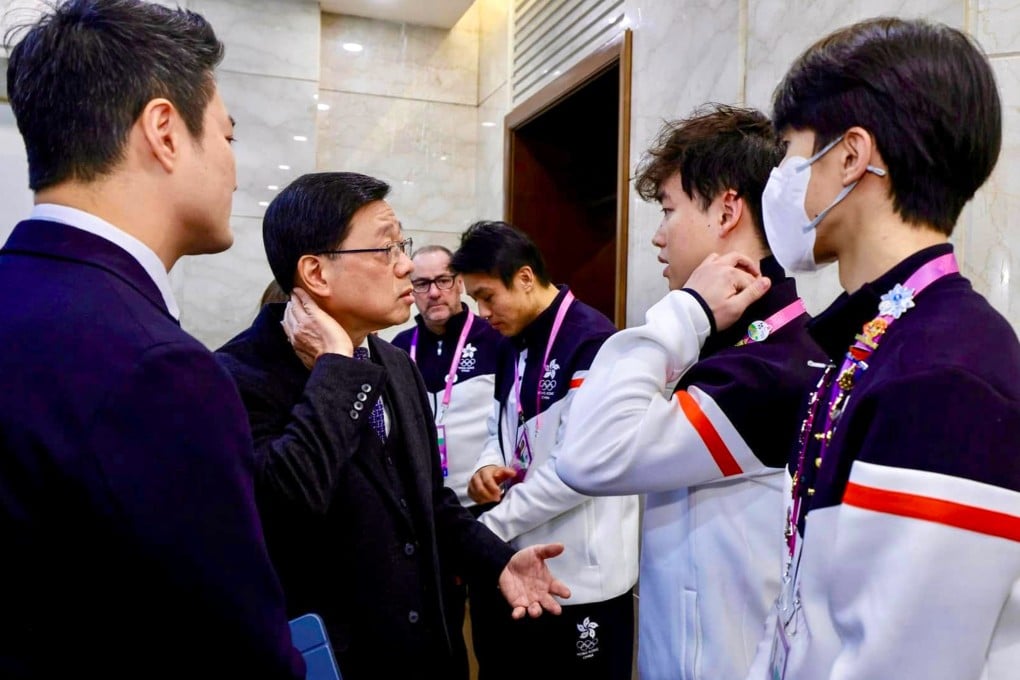 Chief Executive John Lee paid a visit to the athletes’ village to speak to the three Hong Kong ice hockey players injured in a scuffle against Turkmenistan. Photo: Handout