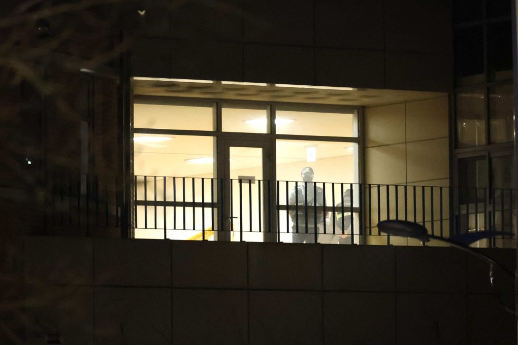 Police officers inspect the scene of the crime at a school in Daejeon on Monday night. Photo: Yonhap/AFP