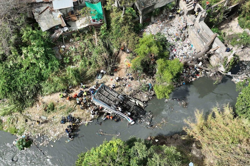 Firefighters and police at the scene of the accident. Photo: AFP