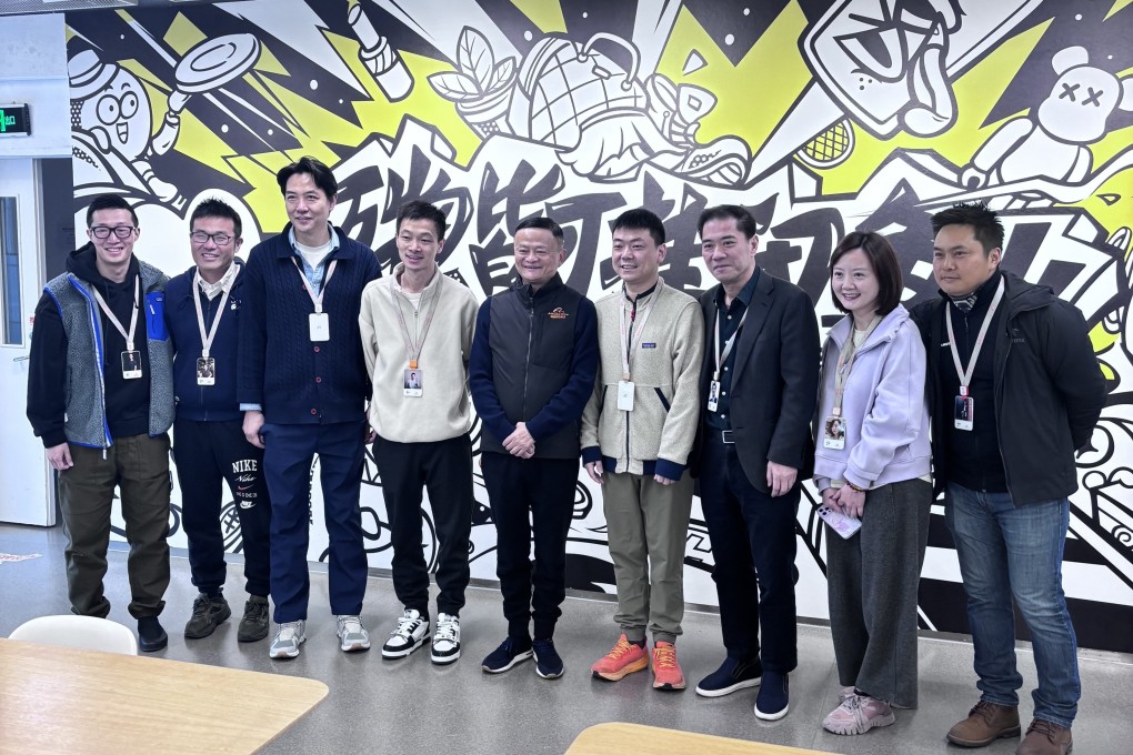 Alibaba founder Jack Ma (fifth from left) visits the offices of second-hand goods platform Xianyu in Hangzhou, capital of Zhejiang province, on Tuesday. Photo: Handout