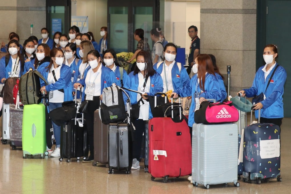 A group of 100 Filipino women, who will participate in a pilot government project as domestic helpers arrives at Incheon International Airport in August 2024. Photo: EPA-EFE/YONHAP