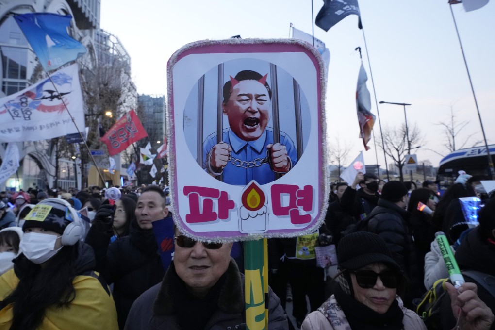Protesters march during a rally on February 1 in Seoul calling for Yoon Suk-yeol to step down as president. Photo: AP