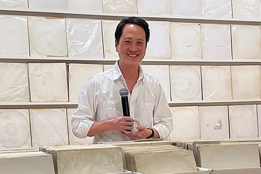 Rutherford Chang stands at an exhibition of his “We Buy White Albums” project - which saw him turn his many copies of The Beatles’ White Album into a piece of conceptual art - in Germany. The American-Chinese artist died on January 24 aged 45. Photo: Instagram/lawrenceartscentergallery
