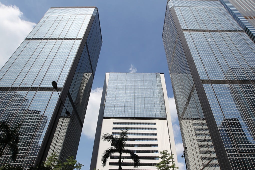 (From left) Revenue Tower, Wanchai Tower and Immigration Tower have been earmarked for redevelopment into a complex connected to the Convention and Exhibition Centre. Photo: Roy Issa