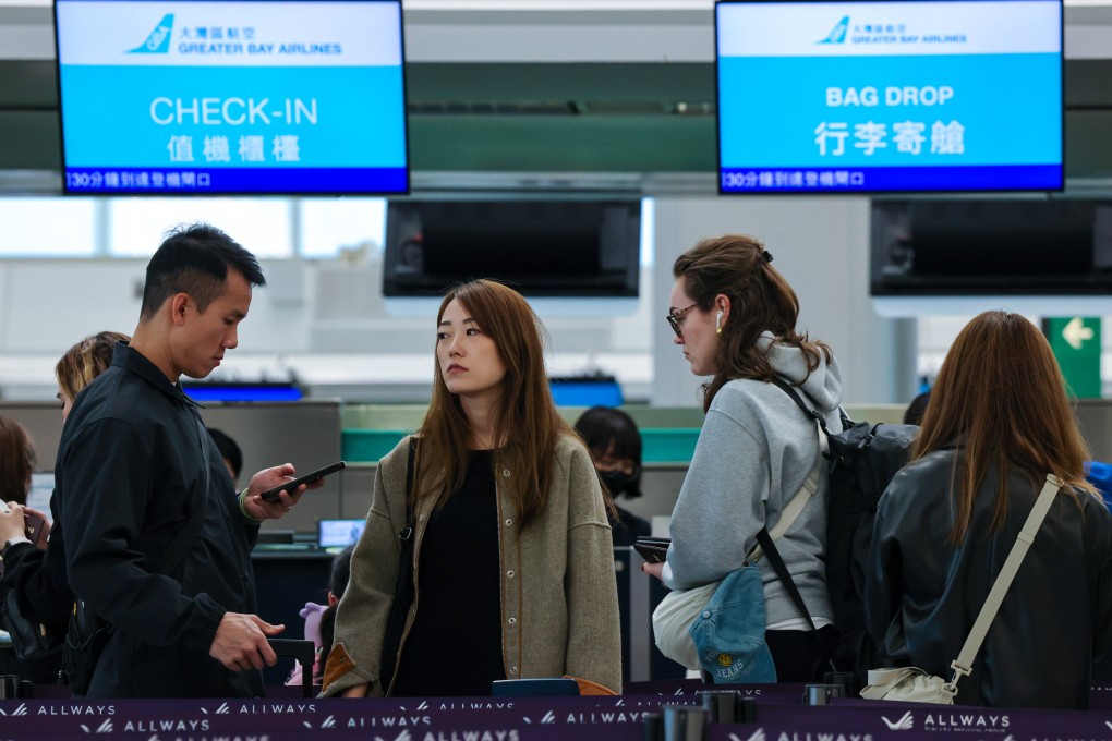 Passengers queue at a Greater Bay Airlines counter at Hong Kong International Airport. The report also acknowledged the heavy strain the incident had placed on the airline’s customer service capabilities Photo: Jelly Tse