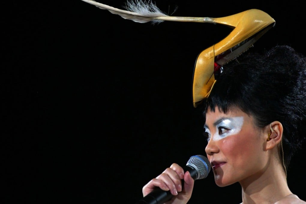 Hong Kong singer-actress Faye Wong, wearing a high heel hat, performs in Hong Kong in 2003. Twice married and twice divorced, Wong walked away from her career in 2005, and has appeared only sporadically on stage since then. Photo: Reuters