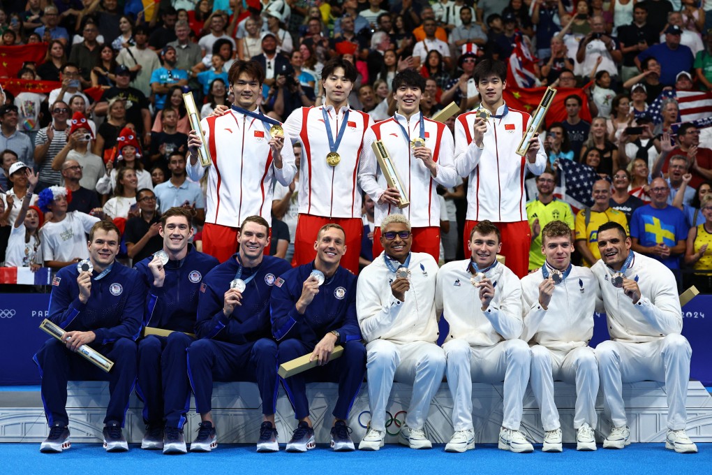 China’s quartet, including Qin Haiyang (second from left), display their gold medals after winning the men’s 4x100m medley relay at the Paris Olympics. Photo: Reuters