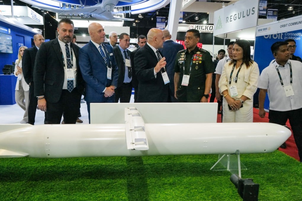 General Romeo Brawner Jnr ( 2nd from right), Armed Forces of the Philippines chief, listens to an underwater drone explanation of an exhibitor at the 5th Asian Defence and Security Exhibition in Manila last year. Photo: Jeoffrey Maitem