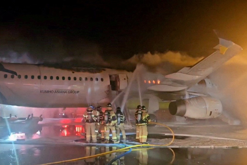 Firefighters put out a blaze from an Air Busan plane at Gimhae airport in Busan, South Korea, on January 28. Photo: Yonhap via Reuters