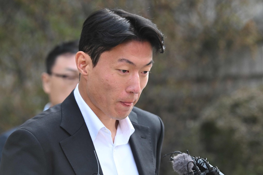 Hwang Ui-jo leaves court in Seoul on Friday after sentencing over his sex-video scandal. Photo: AFP