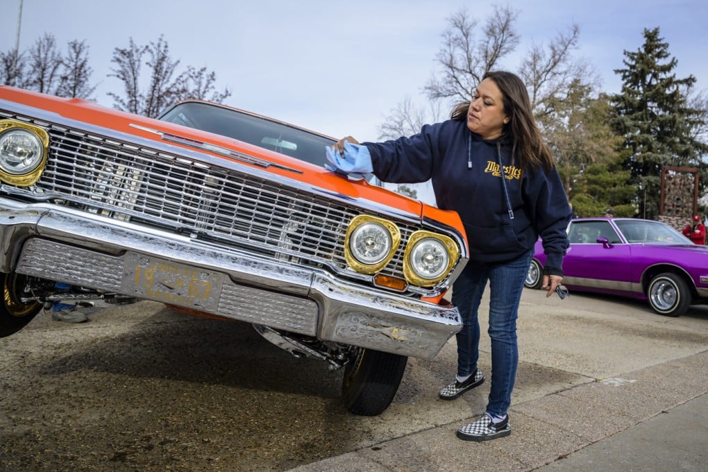 Vicki Garcia cleans her 1963 Chevy Impala low-rider in Santa Fe, New Mexico, on Lowrider Day, February 11. Photo: AP