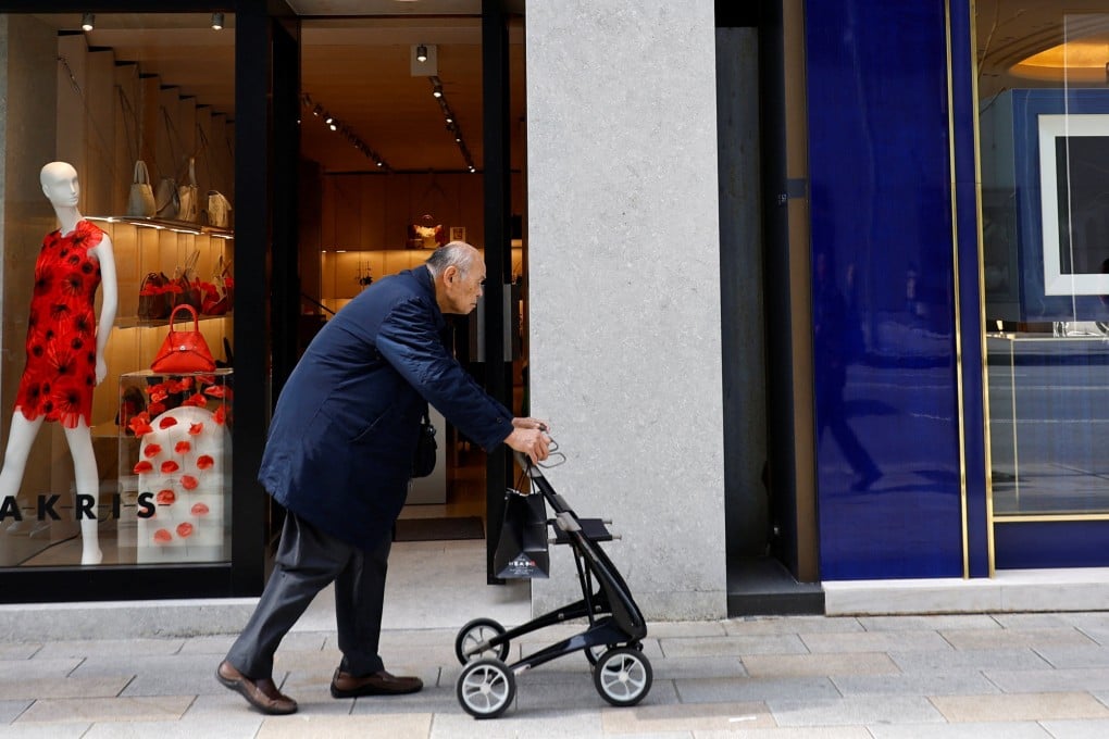 An elderly man walks through a shopping district in Tokyo, Japan. Photo: Reuters
