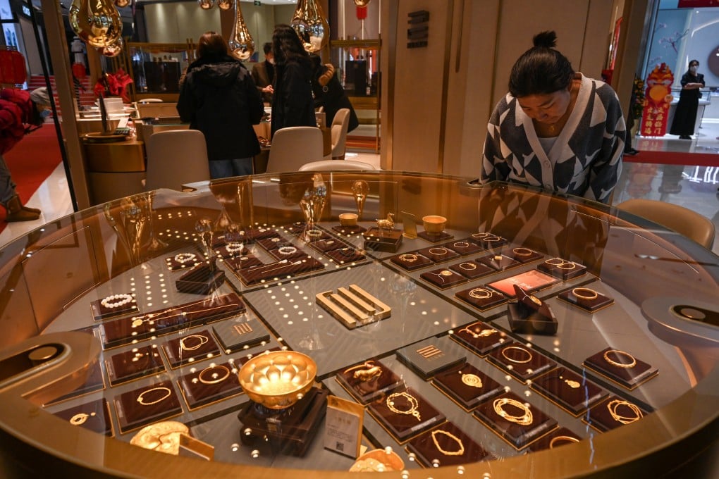 A customer browses gold jewellery at a store in Beijing. Demand for gold soared in China ahead of Valentine’s Day. Photo: AFP
