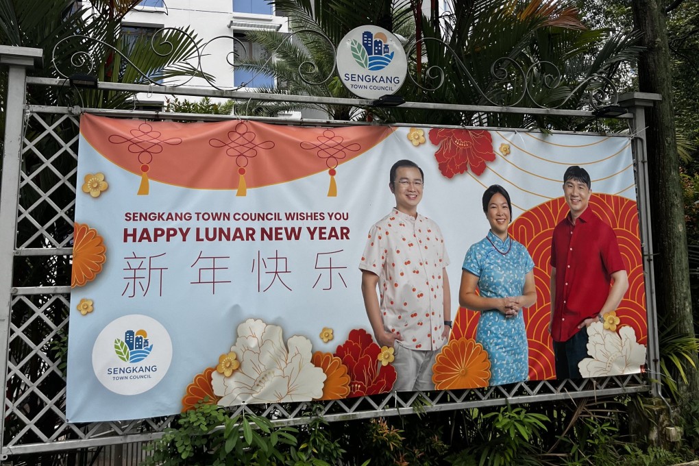 Workers’ Party MPs Louis Chua, He Ting Ru and Jamus Lim pictured on a Lunar New Year banner in Sengkang, Singapore. Photo: Jean Iau
