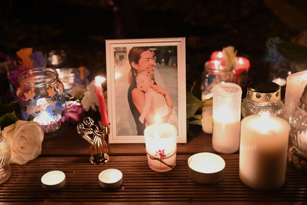 Candles and flowers are seen with a picture during a vigil in central Budapest, Hungary on February 4, 2025 to commemorate a 43-year-old Japanese woman. Photo: AFP