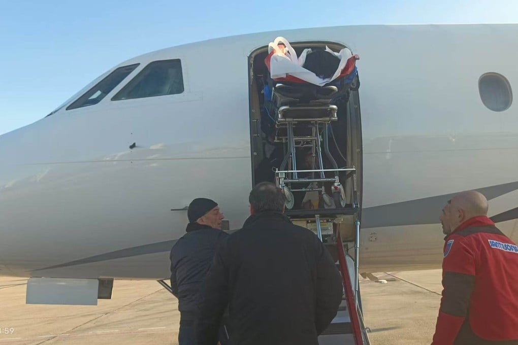 Guo Jiaxuan is transferred to a chartered plane to fly him to Beijing. Photo: Handout