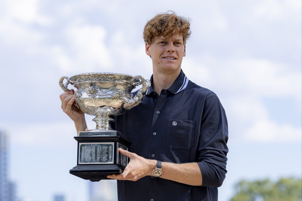 Jannik Sinner poses with the Australian Open trophy that he won last month. Photo: Xinhua
