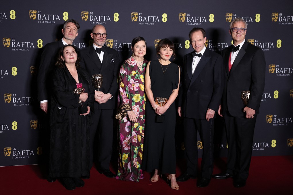 From left, Peter Straughan, Tessa Ross, Edward Berger, Isabella Rossellini, Juliette Howell, Ralph Fiennes and Michael A Jackman in the winners’ room after Conclave won the award for Best Film during the Baftas at the Royal Festival Hall in London on Sunday. Photo: Reuters