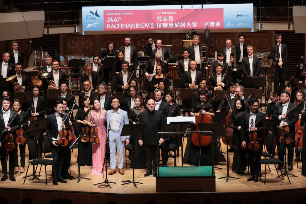 The Hong Kong Philharmonic Orchestra, conductor Jaap van Zweden,  soloist Esther Yoo and composer Raymond Yiu are applauded by the audience at the Hong Kong Cultural Centre after the Asian premiere of Yiu’s Violin Concerto on February 14, 2025. Photo: Keith Hiro/ HK Phil