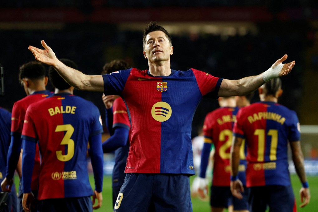 Barcelona’s Robert Lewandowski celebrates after his match-winning penalty against Rayo Vallecano. Photo: Reuters