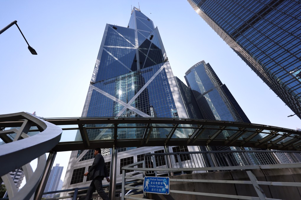 A man crosses a footbridge in front of the Bank of China Tower in Central on January 6, 2025. Photo: Jelly Tse