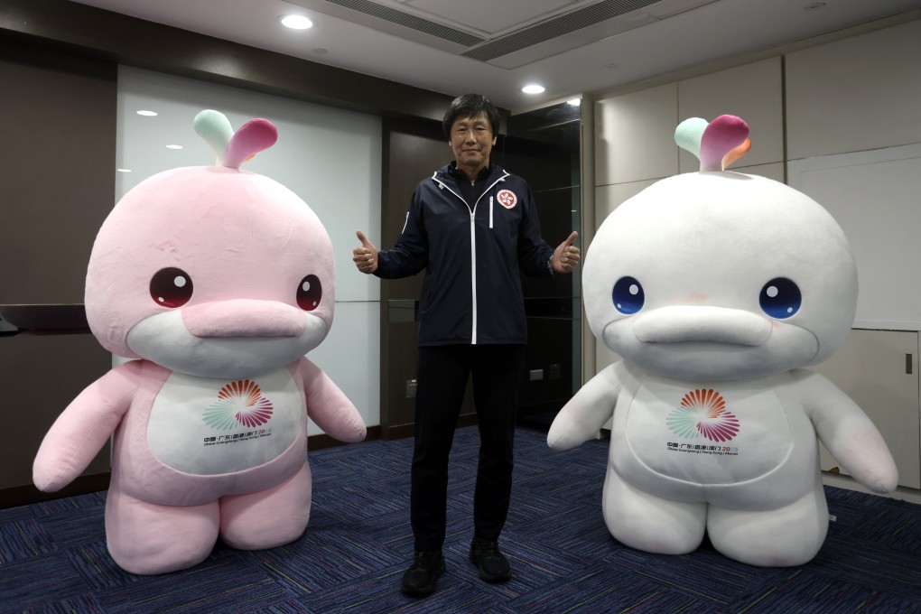 Yeung Tak-keung, head of the National Games Coordination Office, with Games mascots Lerongrong (left) and Xiyangyang at his offices in Wan Chai. Photo: Jonathan Wong