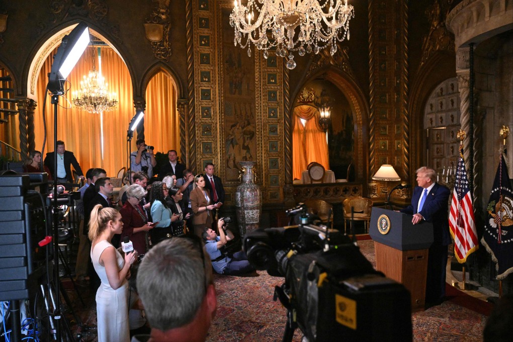 US President Donald Trump speaks to the media at his Mar-a-Lago resort in Florida on Tuesday. Trump has proposed raising tariffs on cars, chips and drugs by at least 25 per cent. Photo: AFP