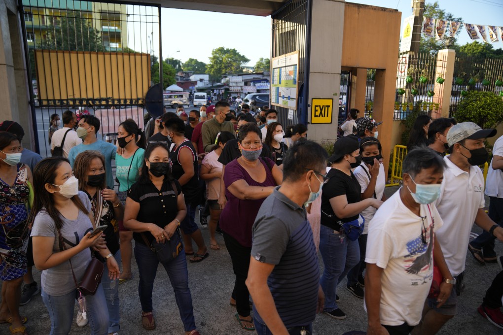 Voters enter a polling centre in 2022 in Quezon City to vote for a new president of the Philippines. Photo: AP