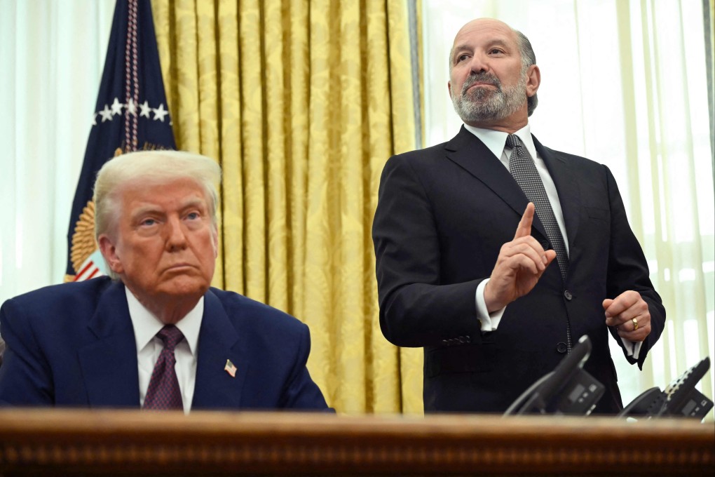 Before his appointment as US commerce secretary was confirmed on Tuesday, Howard Lutnick appeared at the White House’s Oval Office in Washington with US President Donald Trump on February 13. Photo: AFP