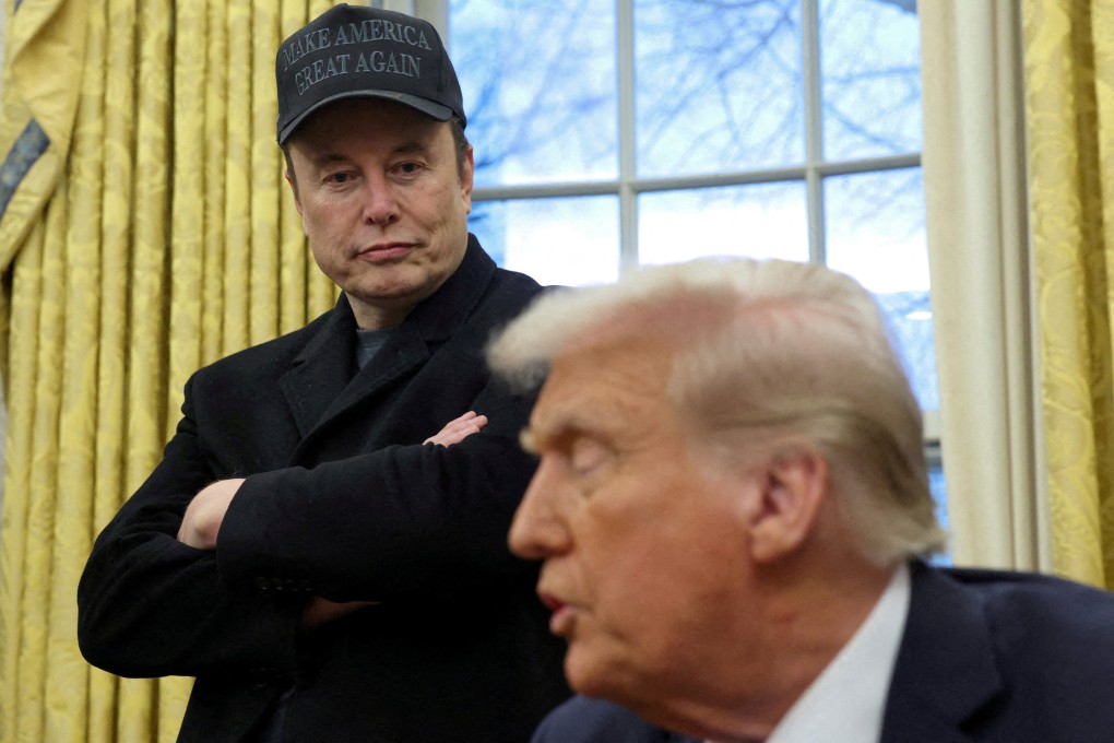 Elon Musk listens to US President Donald Trump speak in the Oval Office on February 11. Photo: Reuters