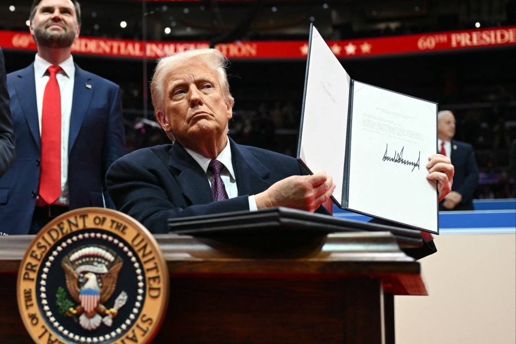 US President Donald Trump holds letter to the UN stating the US withdrawal from the Paris Agreement in Washington, DC, on January 20, 2025. Photo: AFP
