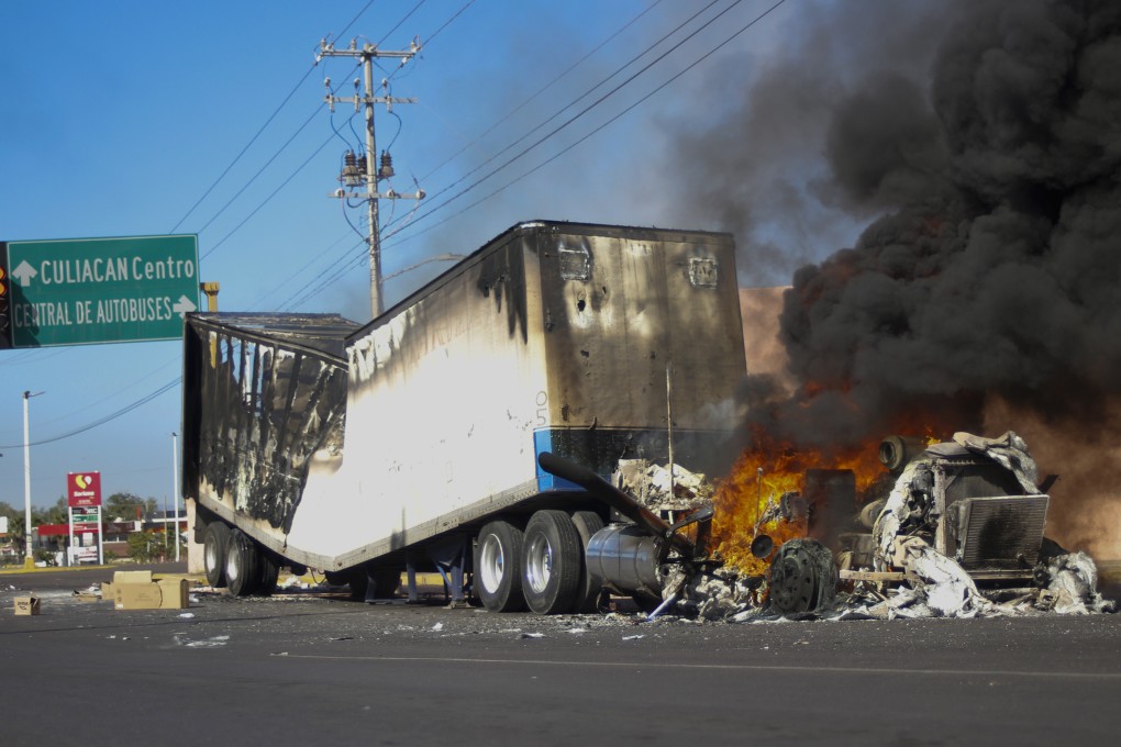 A truck burns on a street in Culiacan, Sinaloa state, Mexico, in January 2023 after Mexican security forces captured Ovidio Guzman, a son of former Sinaloa cartel boss “El Chapo”, seting off gunfights and roadblocks. Photo: AP
