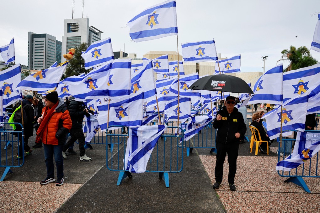 People in Tel Aviv on the day the bodies of deceased Israeli hostages, Oded Lifschitz, Shiri Bibas and her two children Kfir and Ariel Bibas, are handed over under the terms of a ceasefire between Hamas and Israel. Photo: Reuters