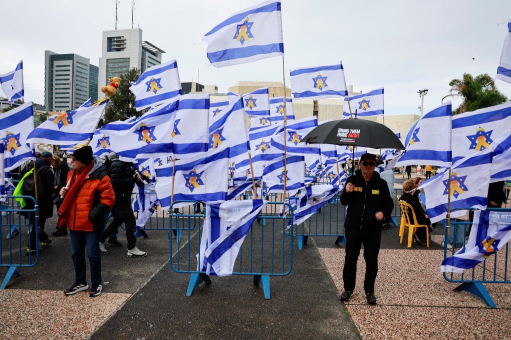 People in Tel Aviv on the day the bodies of deceased Israeli hostages, Oded Lifschitz, Shiri Bibas and her two children Kfir and Ariel Bibas, are handed over under the terms of a ceasefire between Hamas and Israel. Photo: Reuters