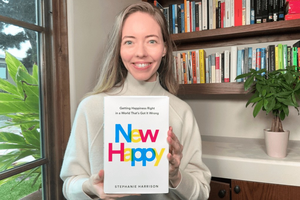 Positive psychologist Stephanie Harrison with her bestselling guide New Happy: Getting Happiness Right in a World That’s Got It Wrong. Photo: The New Happy