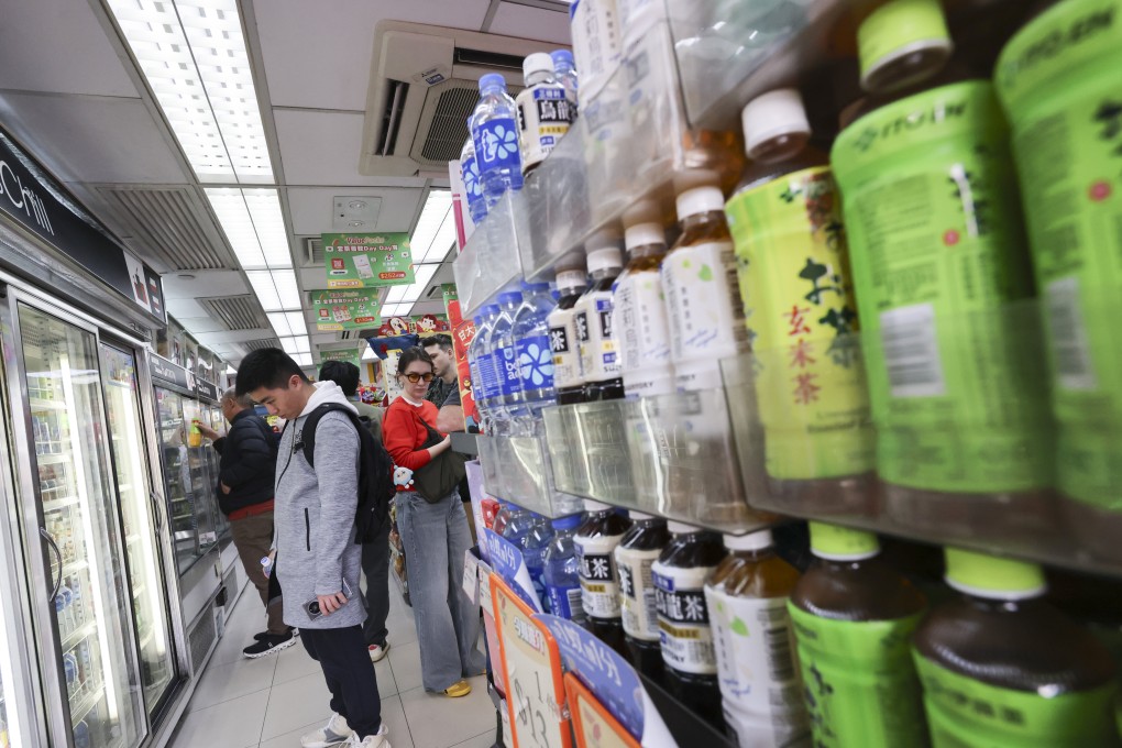 People buy drinks at a convenience store in Tsim Sha Tsui on February 18. Photo: Jelly Tse