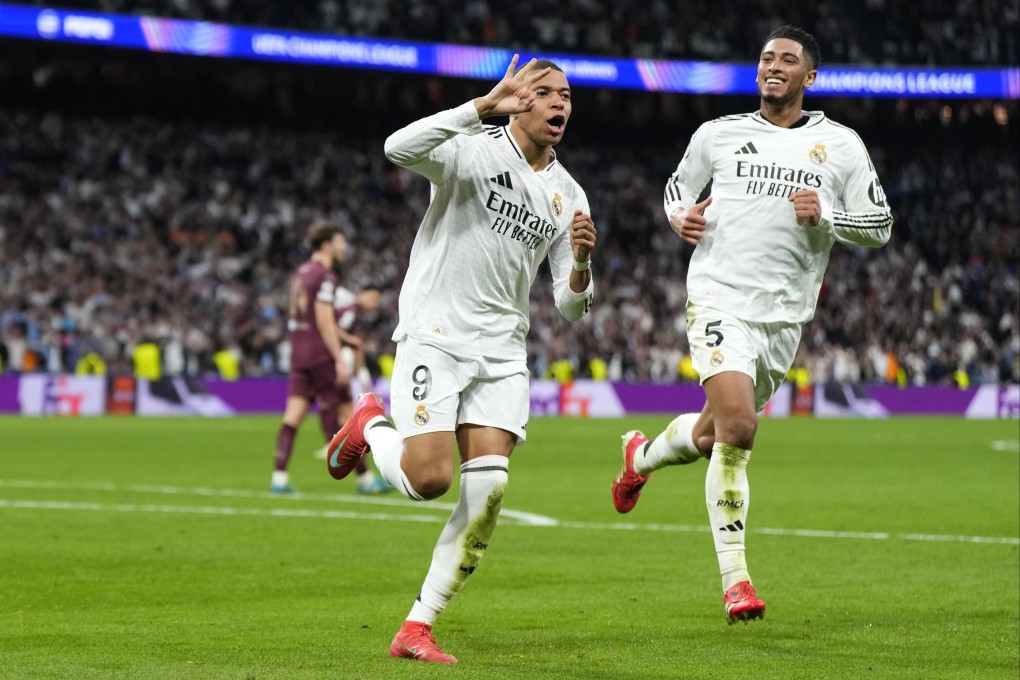 Real Madrid’s Kylian Mbappe (left) celebrates with Jude Bellingham after completing his hat-trick against Manchester City. Photo: AP