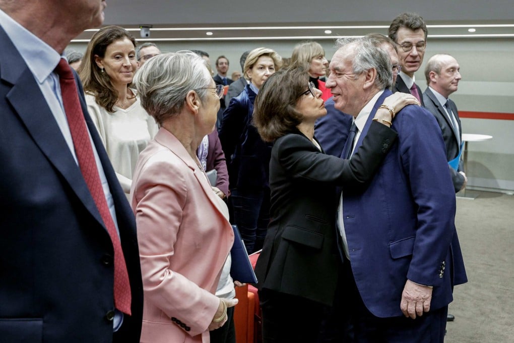 France’s Minister of Education, Higher Education and Research Elisabeth Borne looks at France’s Prime Minister Francois Bayrou (right) being welcomed by France’s Minister of Culture Rachida Dati (middle), ahead of the start of a meeting with the State’s senior executives in Paris on February 21. Photo: AFP