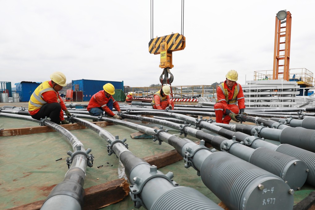 Men working on the Shiziyang grand bridge, part of the Shiziyang Channel mega-project to boost economic development around the Pearl River, in Guangdong, China on February. 7. Unlike many other governments, China’s has shown success in providing basic infrastructure across the nation. Photo: Xinhua