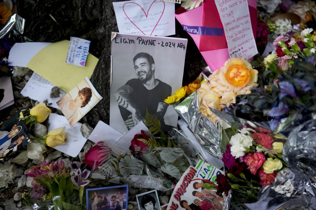 A  makeshift memorial to former One Direction singer Liam Payne outside the hotel where he fell from a balcony to his death, in Buenos Aires, Argentina on October 17. On Thursday, an Argentine court dropped charges against three people tied to his death. Photo: AP