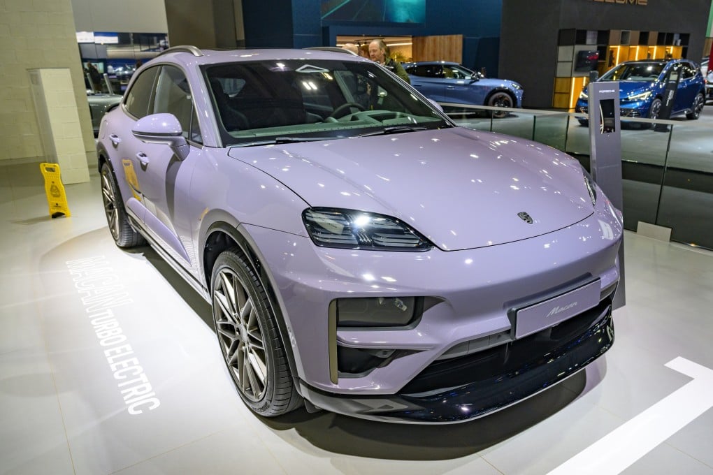 BRUSSELS, BELGIUM - JANUARY 10: Porsche Macan Turbo Electric compact luxury crossover battery electric SUV car on display at the AutoSalon on January 10, 2025 in Brussels, Belgium. (Photo by Sjoerd van der Wal/Getty Images)